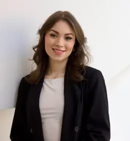 A person with long brown hair wearing a white shirt

AI-generated content may be incorrect.